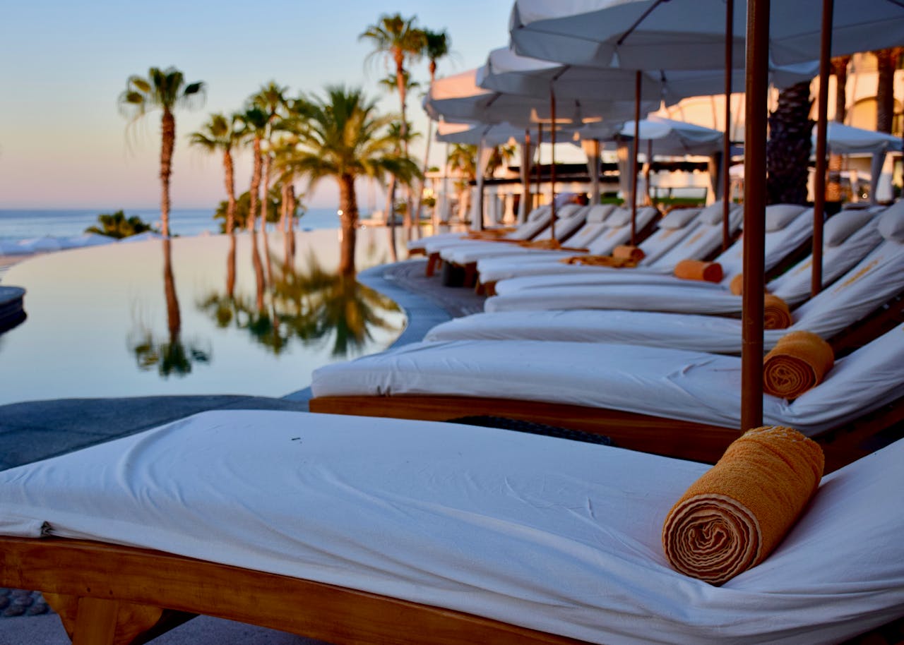 our-story-02 Experience luxury relaxation at a poolside resort in Cabo San Lucas, Mexico.
